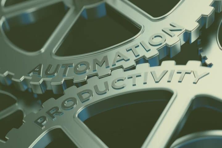An image with two cog wheels one wheel has the word automation on it and the other productivity